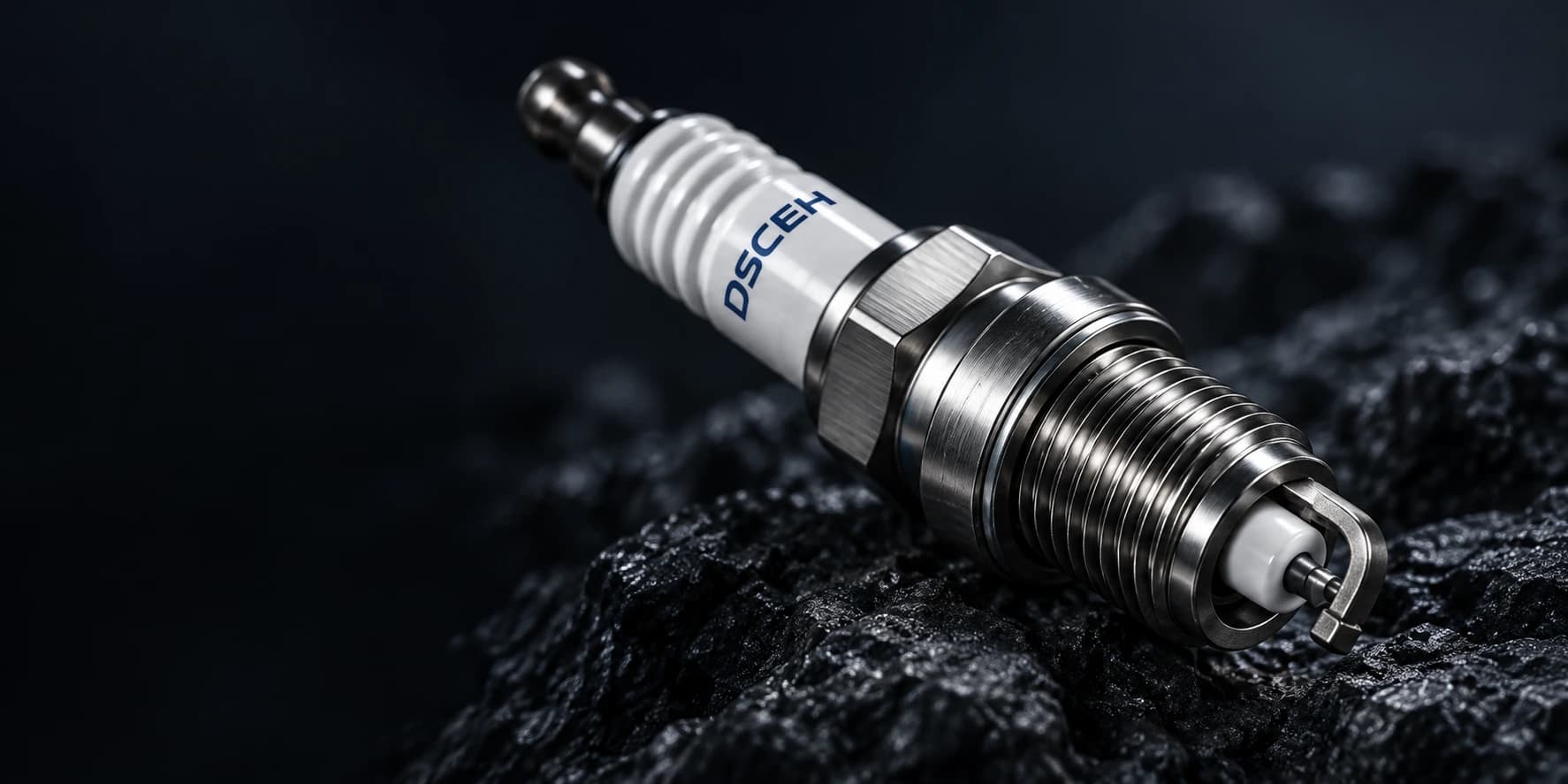 Close-up of a spark plug's ceramic insulator, shell and firing end — concept visual